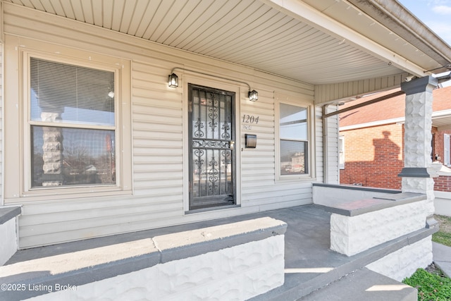 doorway to property featuring a porch