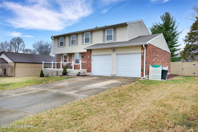 view of front facade with a front yard, fence, brick siding, and driveway