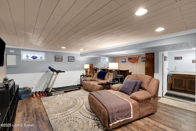 living area featuring recessed lighting, a wainscoted wall, wood finished floors, and wooden ceiling