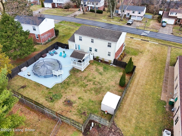 birds eye view of property with a residential view