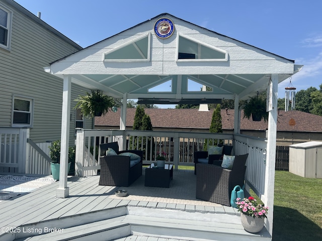 wooden deck featuring a gazebo and an outdoor living space