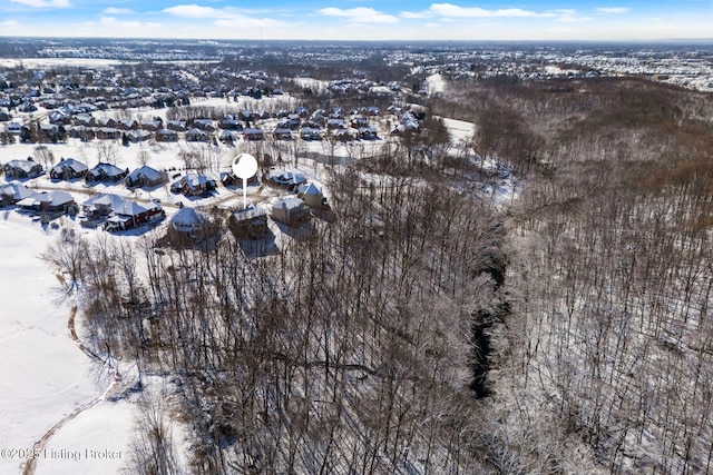 snowy aerial view with a residential view