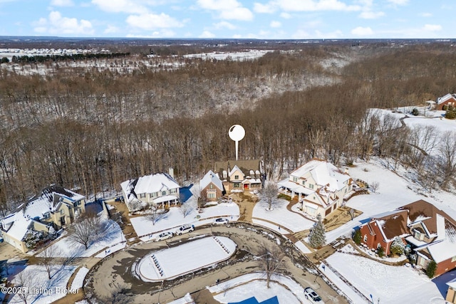 snowy aerial view with a residential view