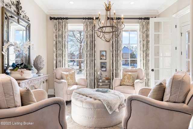 living area with an inviting chandelier, ornamental molding, and a wealth of natural light