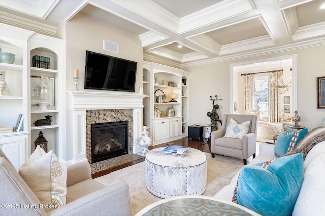 living area featuring a tile fireplace, coffered ceiling, wood finished floors, beam ceiling, and crown molding