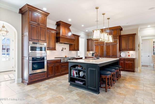 kitchen featuring custom range hood, stainless steel appliances, a sink, and light countertops