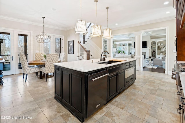 kitchen featuring a healthy amount of sunlight, light countertops, and a sink