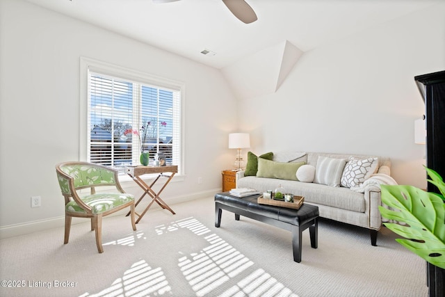 living area featuring light carpet, ceiling fan, visible vents, and baseboards