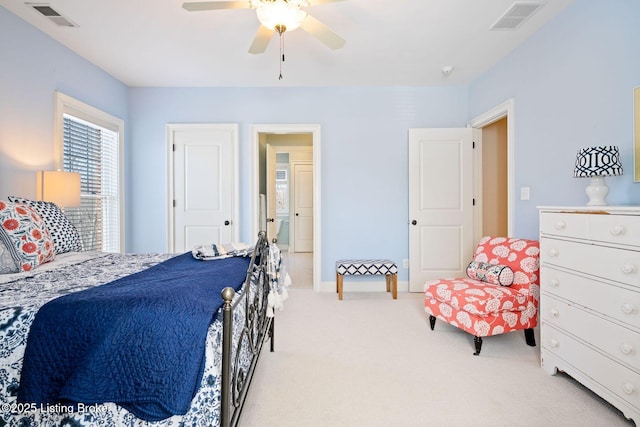 bedroom with a ceiling fan, baseboards, visible vents, and carpet flooring