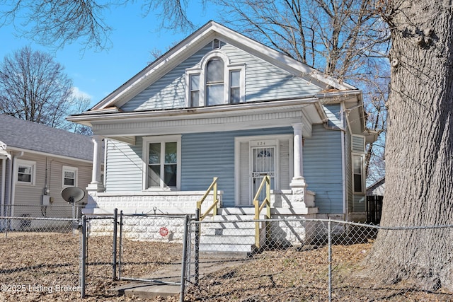 bungalow-style house featuring a fenced front yard, covered porch, and a gate