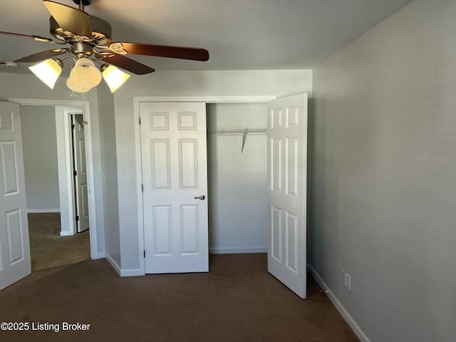 unfurnished bedroom featuring a ceiling fan, carpet, a closet, and baseboards