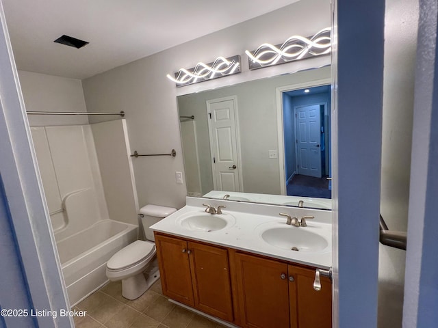 full bathroom with tile patterned flooring, a sink, toilet, and double vanity