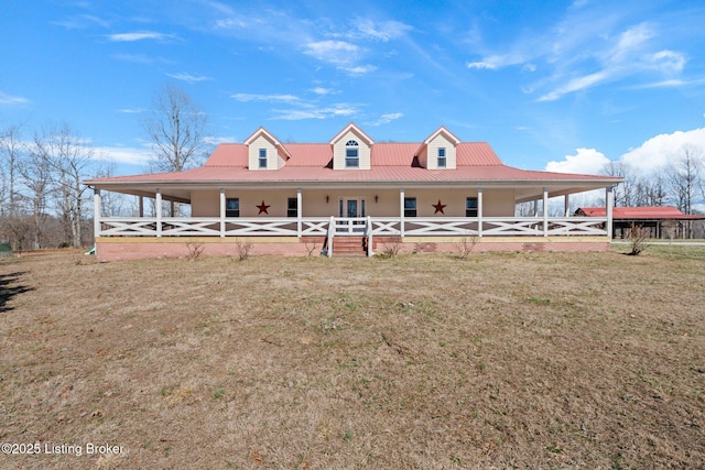 country-style home featuring covered porch and metal roof