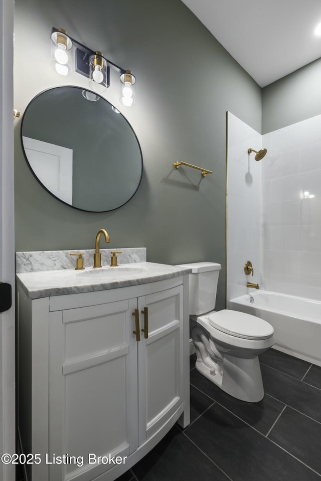 bathroom with toilet, tile patterned floors, bathing tub / shower combination, and vanity