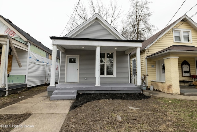 shotgun-style home featuring a porch