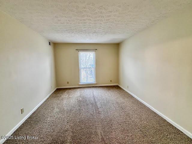 1515 La Fontenay Ct, Louisville, KY 40223 - carpeted spare room with baseboards and a textured ceiling