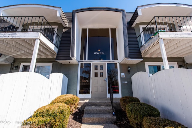 property entrance featuring stucco siding