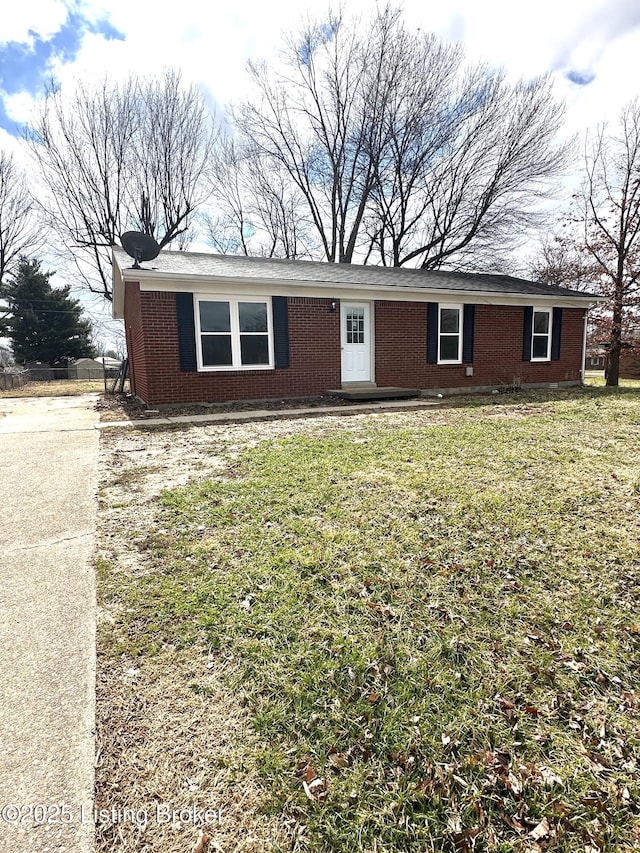 ranch-style home with brick siding and a front yard