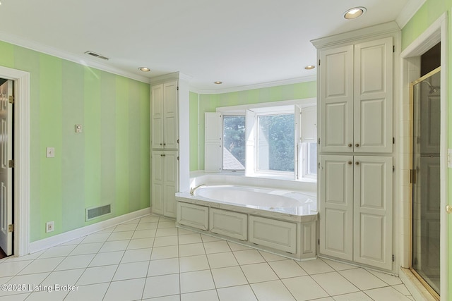 bathroom featuring crown molding, visible vents, and a bath