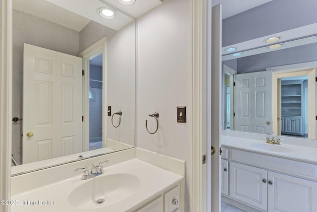 bathroom with vanity and recessed lighting