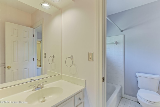 full bathroom featuring baseboards, toilet, tile patterned flooring, tub / shower combination, and vanity