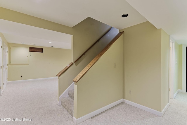 staircase featuring carpet floors, recessed lighting, and baseboards