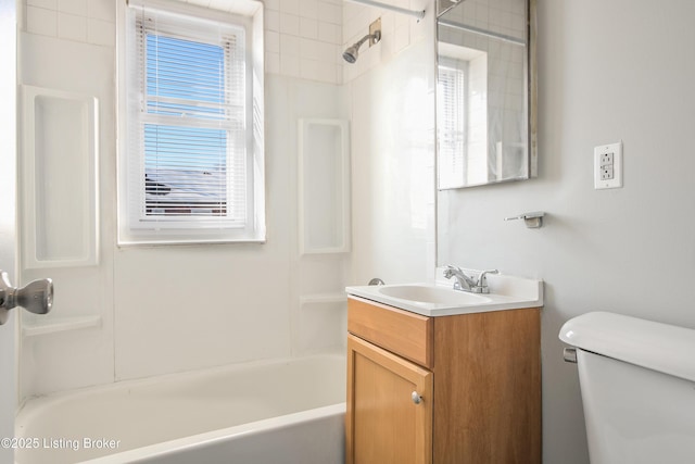 bathroom with  shower combination, vanity, and toilet