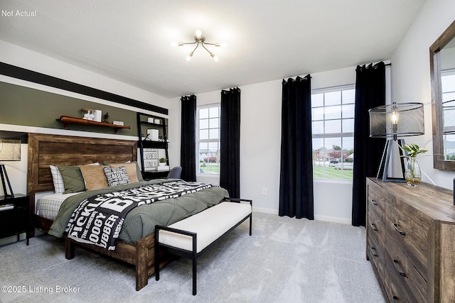 carpeted bedroom featuring baseboards