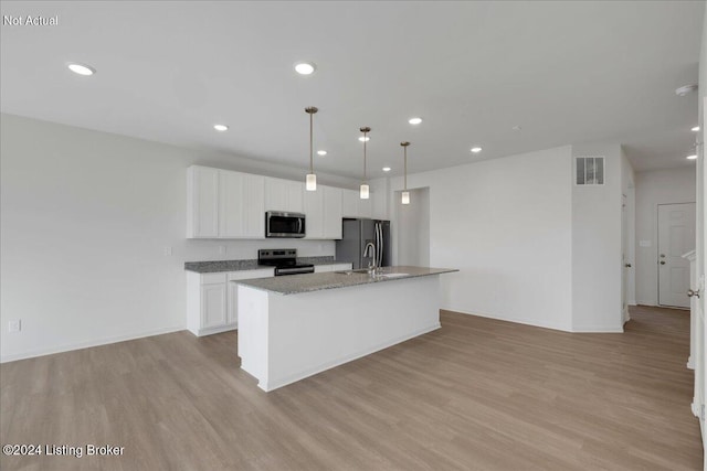 kitchen with light wood-style floors, a kitchen island with sink, visible vents, and stainless steel appliances