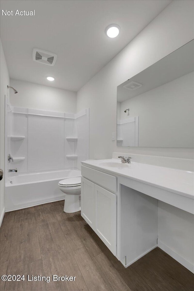 bathroom with shower / washtub combination, visible vents, toilet, vanity, and wood finished floors