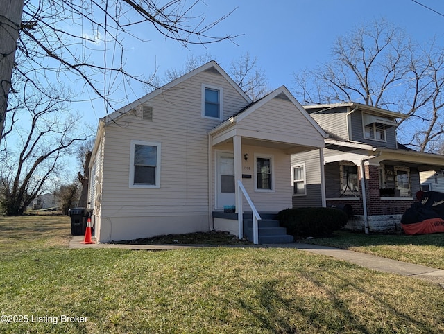 bungalow-style home featuring a front lawn