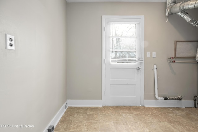 washroom featuring laundry area, visible vents, and baseboards