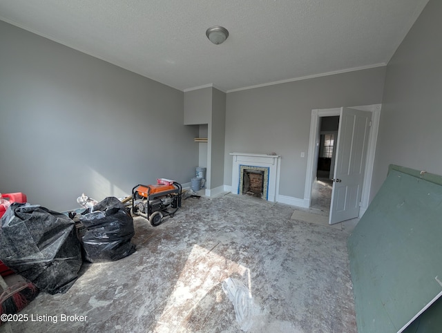 unfurnished living room featuring a textured ceiling, crown molding, a fireplace, and baseboards