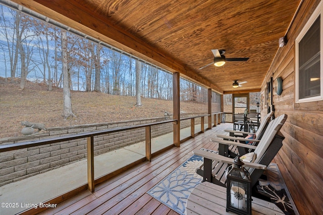 wooden deck with a ceiling fan and covered porch