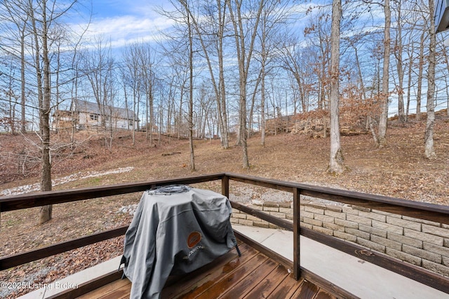 wooden terrace featuring grilling area