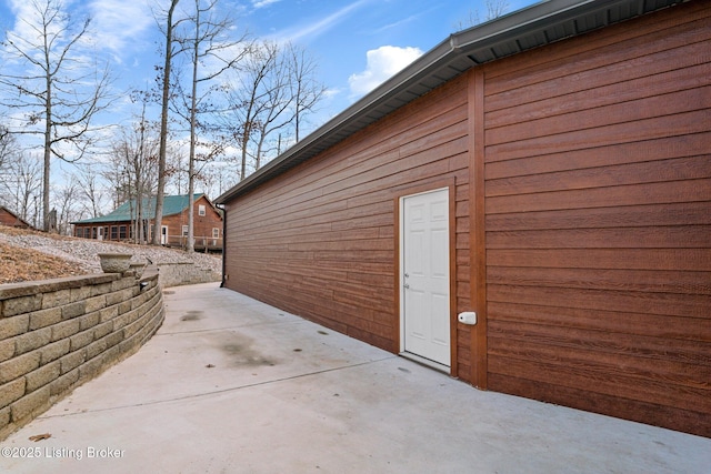 view of side of home featuring a patio