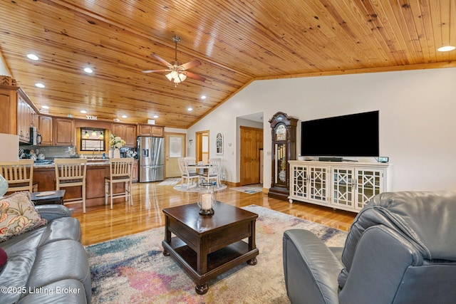 living room featuring lofted ceiling, recessed lighting, a ceiling fan, wood ceiling, and light wood-style floors