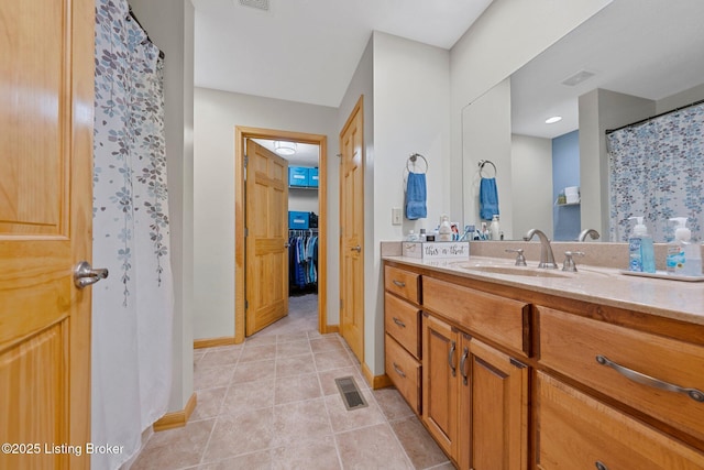 full bathroom featuring vanity, visible vents, and tile patterned floors