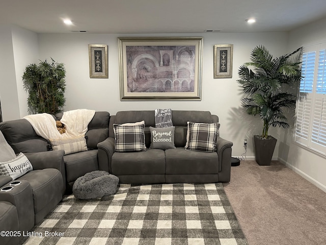 carpeted living area featuring visible vents, baseboards, and recessed lighting