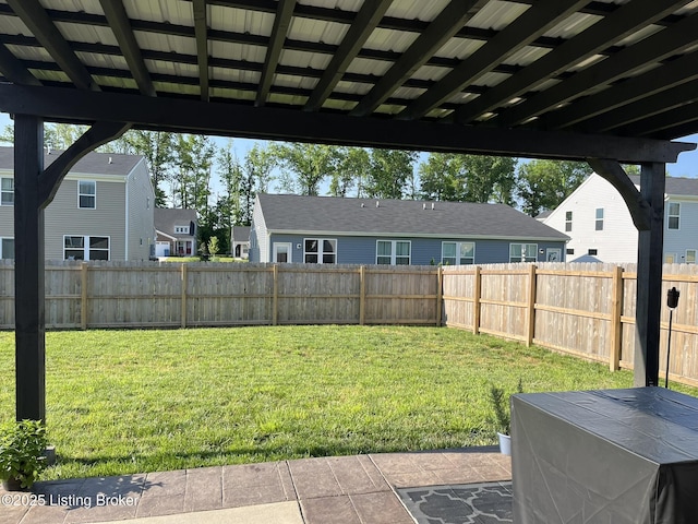 view of yard with a residential view and a fenced backyard