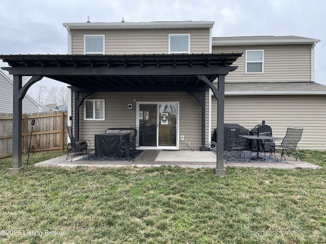 rear view of property with a patio area, fence, and a lawn