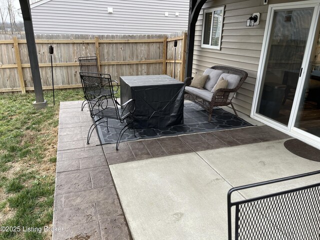 view of patio featuring fence