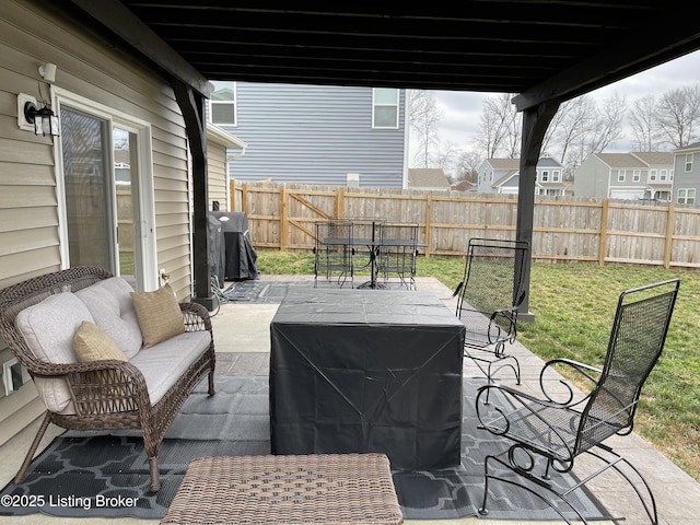 view of patio / terrace featuring grilling area, a fenced backyard, outdoor lounge area, and outdoor dining space