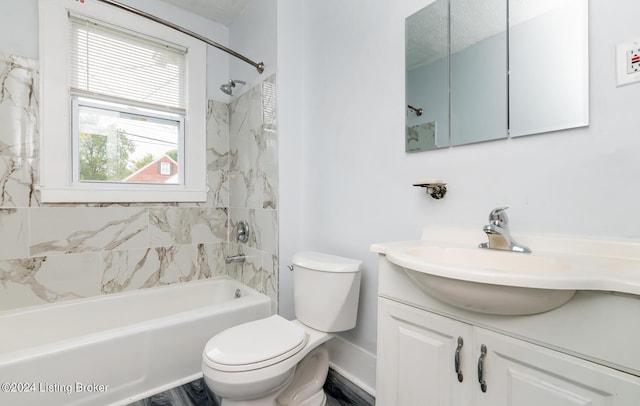 bathroom featuring toilet, bathing tub / shower combination, baseboards, and vanity