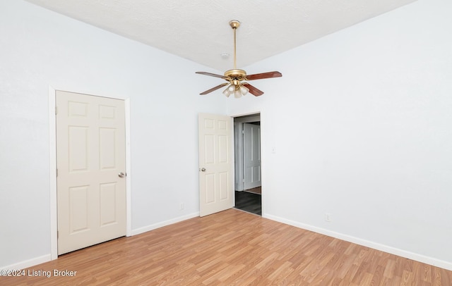 empty room with baseboards and light wood finished floors