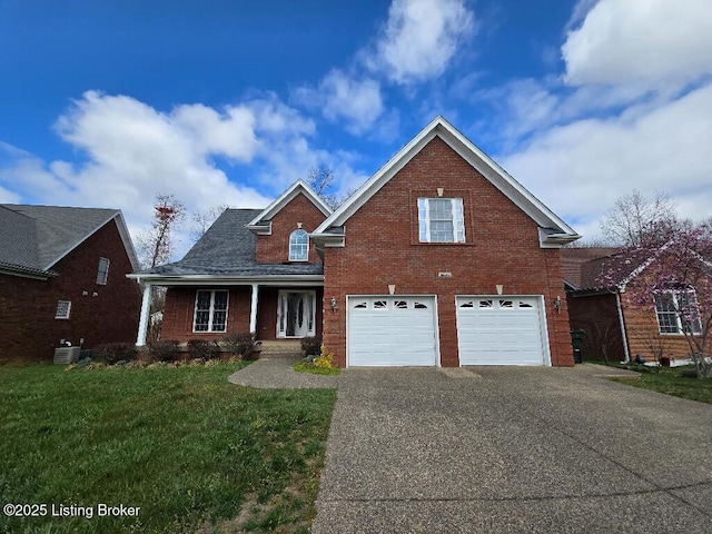 traditional-style house with brick siding, central air condition unit, a garage, driveway, and a front lawn