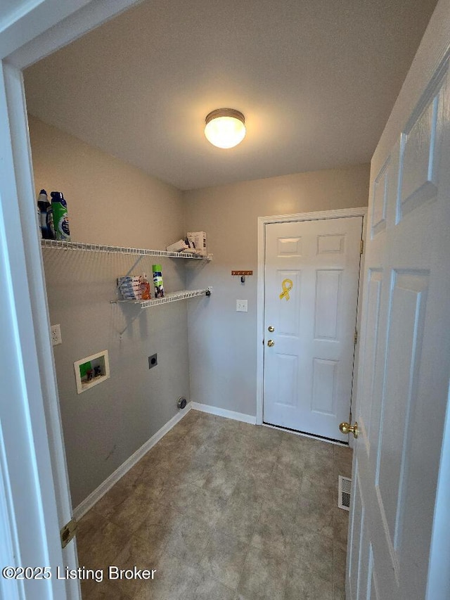 laundry area featuring hookup for an electric dryer, laundry area, washer hookup, visible vents, and baseboards