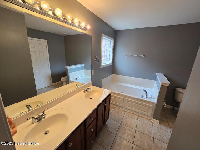 full bathroom with toilet, a sink, and a bath