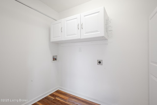 clothes washing area with cabinet space, baseboards, dark wood-type flooring, hookup for an electric dryer, and washer hookup