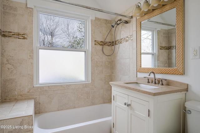 bathroom with shower / tub combination, vanity, and toilet